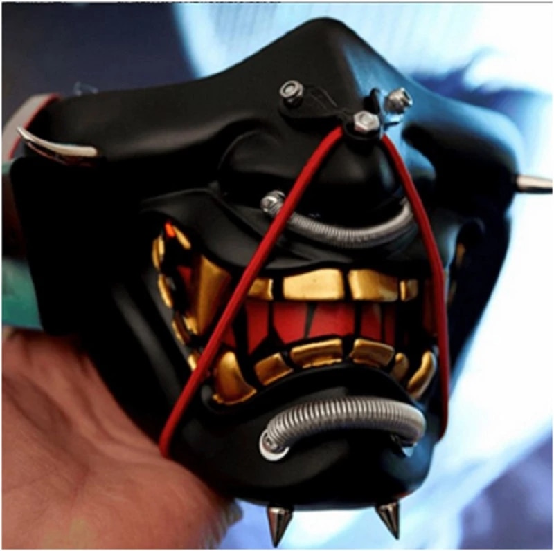 Demi masque japonais samouraï noir avec dents dorées et cordon rouge, détail face avant